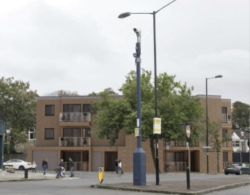 Residential development of brick apartments and townhouses on a corner site